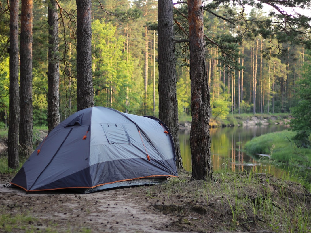 gray-and-black-tent-near-lake-during-daytime-m4qmhs-o4xg